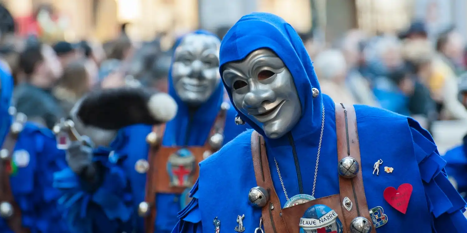 Photo of a person wearing a mask at a carnival