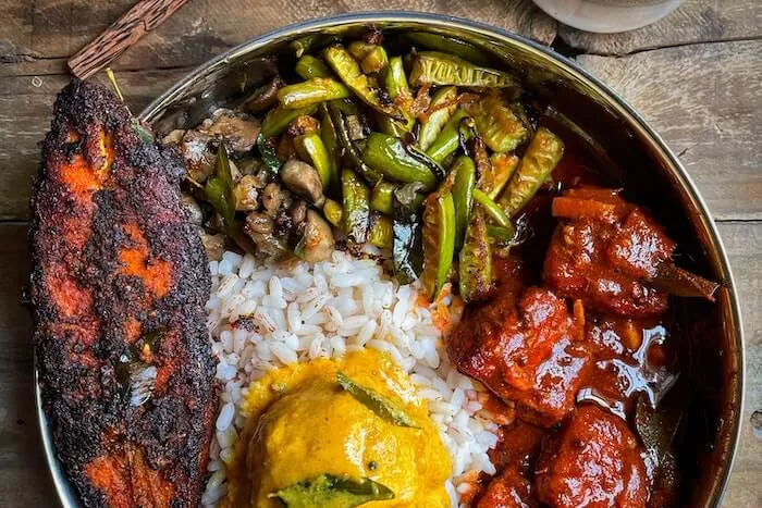 Photo of a grilled salmon with lemon and dill.